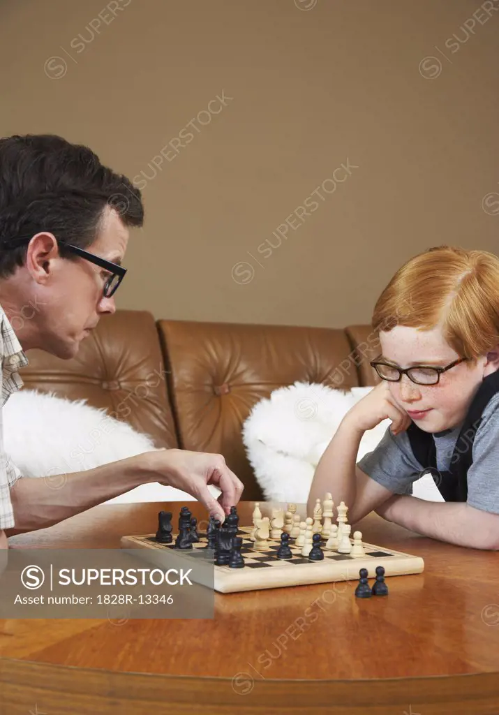 Father and Son Playing Chess   