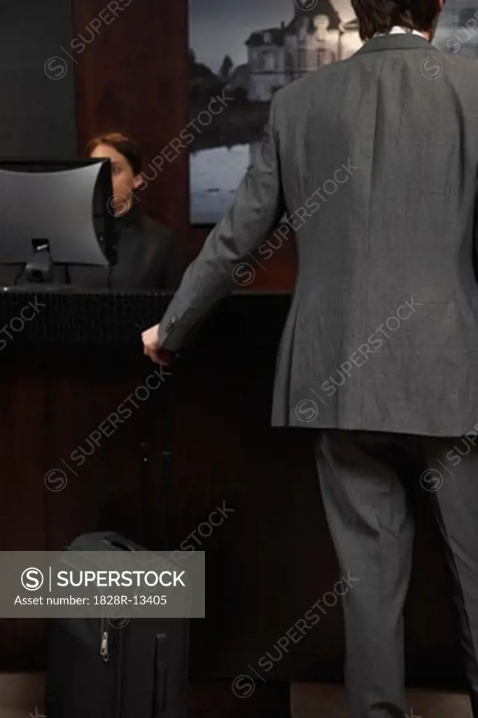 Businessman at Hotel Desk   