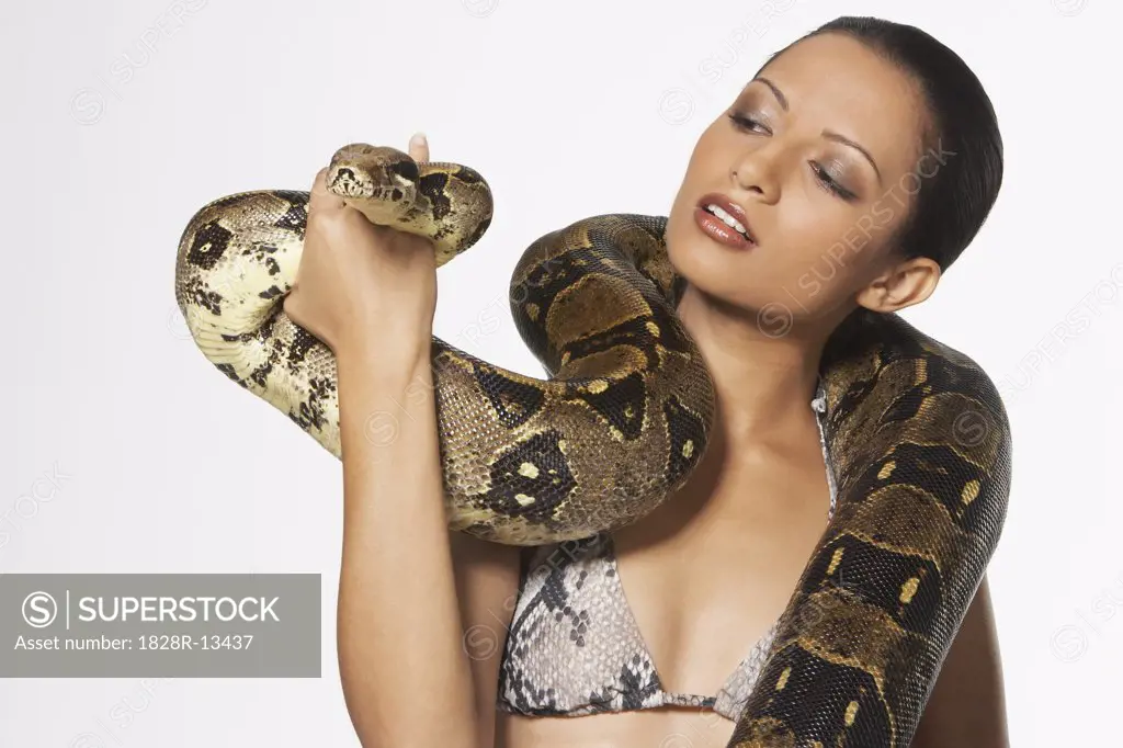 Portrait of Woman with Boa Constrictor Wrapped Around Neck   