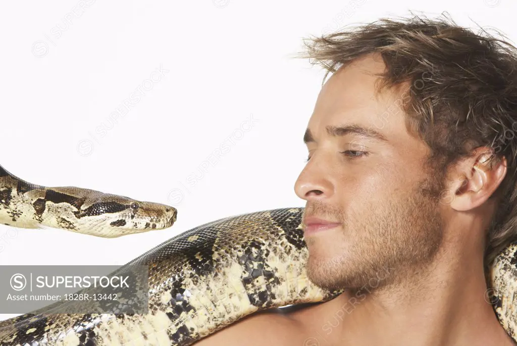 Close-up of Man and Snake Looking at Each Other   