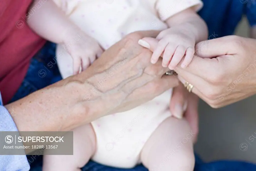 Baby in the Hands of her Mother and Grandmother   