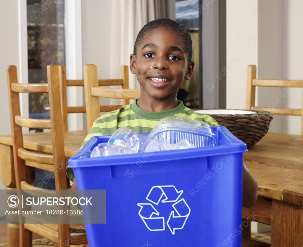 Boy Holding Recycling Bin   