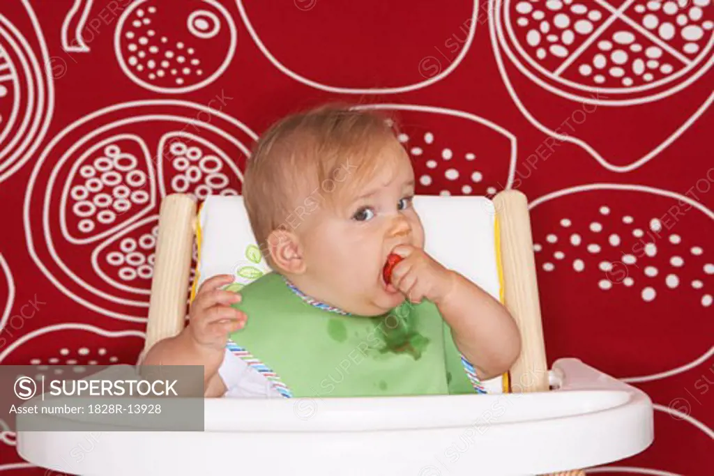 Baby Eating in High Chair   