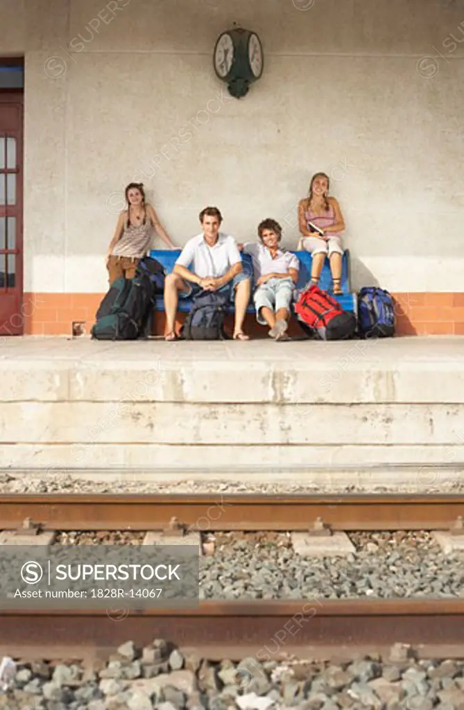 People Waiting at Train Station   
