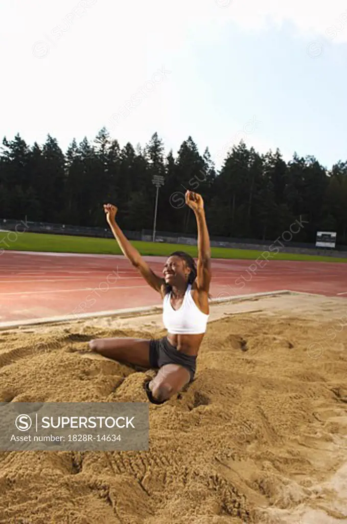 Woman Cheering after Long Jump   