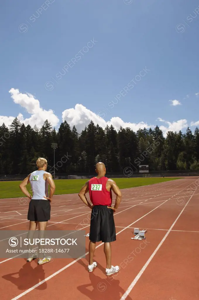 Men Standing on Track   