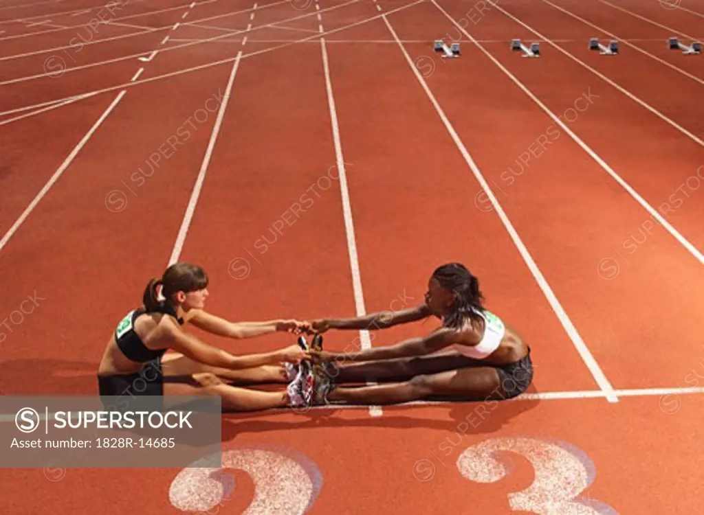 Women Stretching on Track   