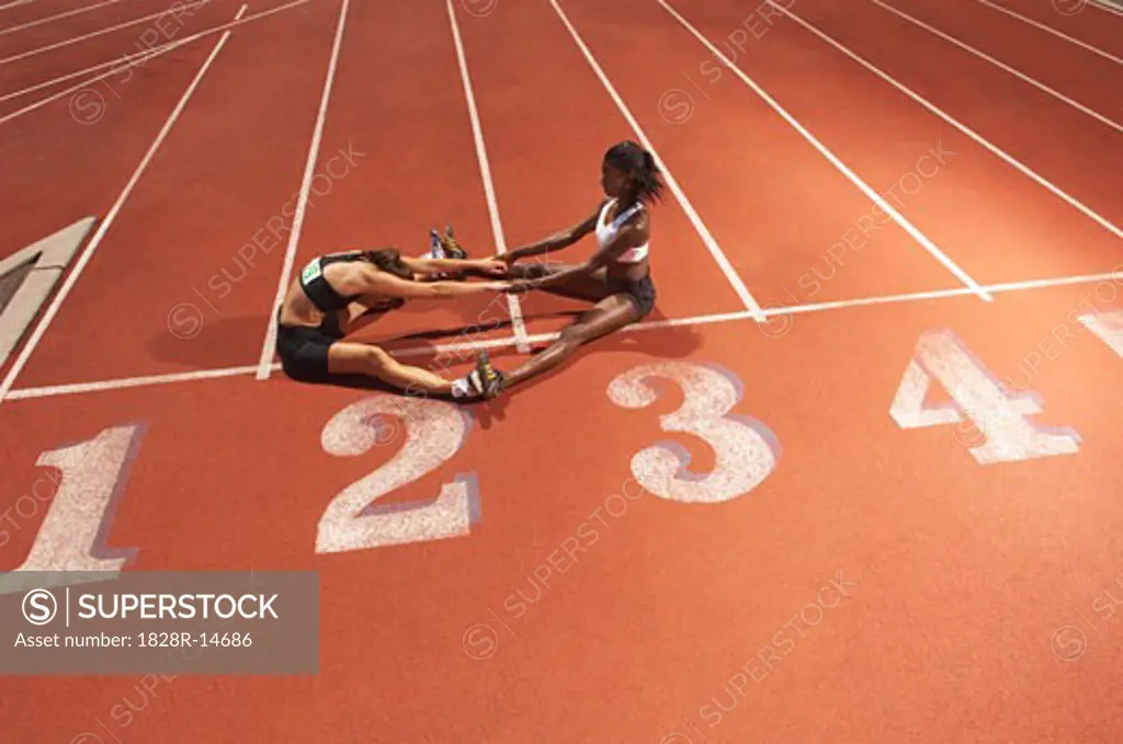 Women Stretching on Track   
