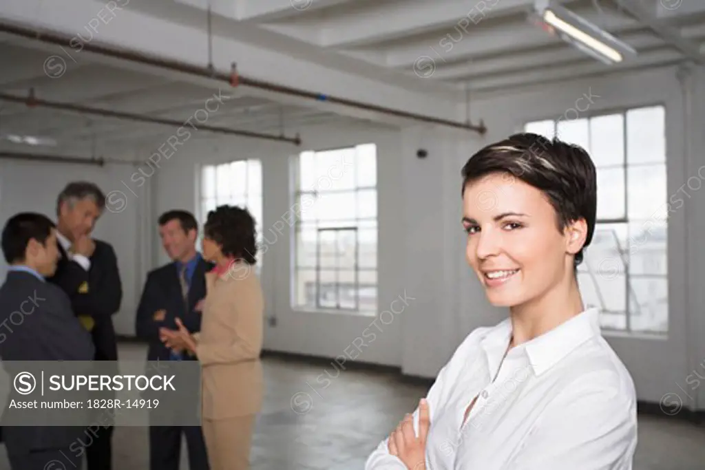 Portrait of Businesswoman with other Business People in Background   