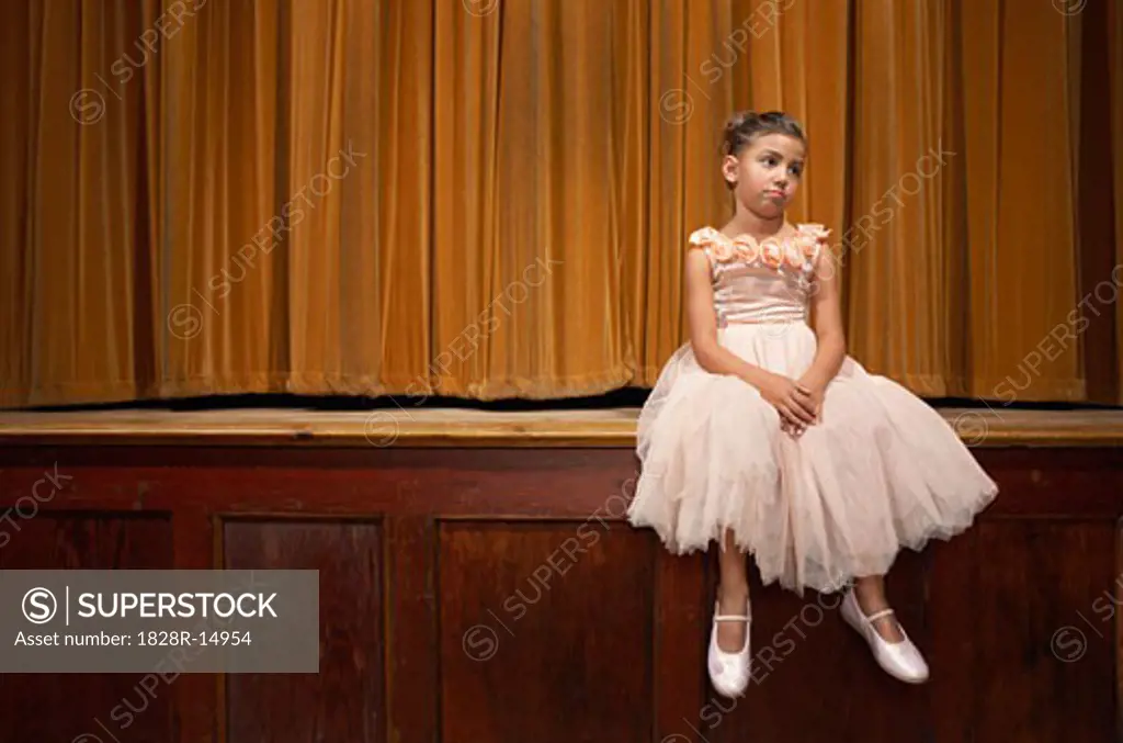 Girl Sitting on Stage   
