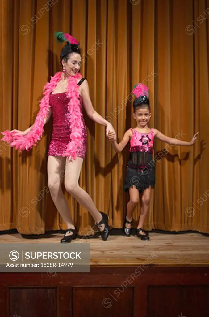 Woman and Girl Performing on Stage   