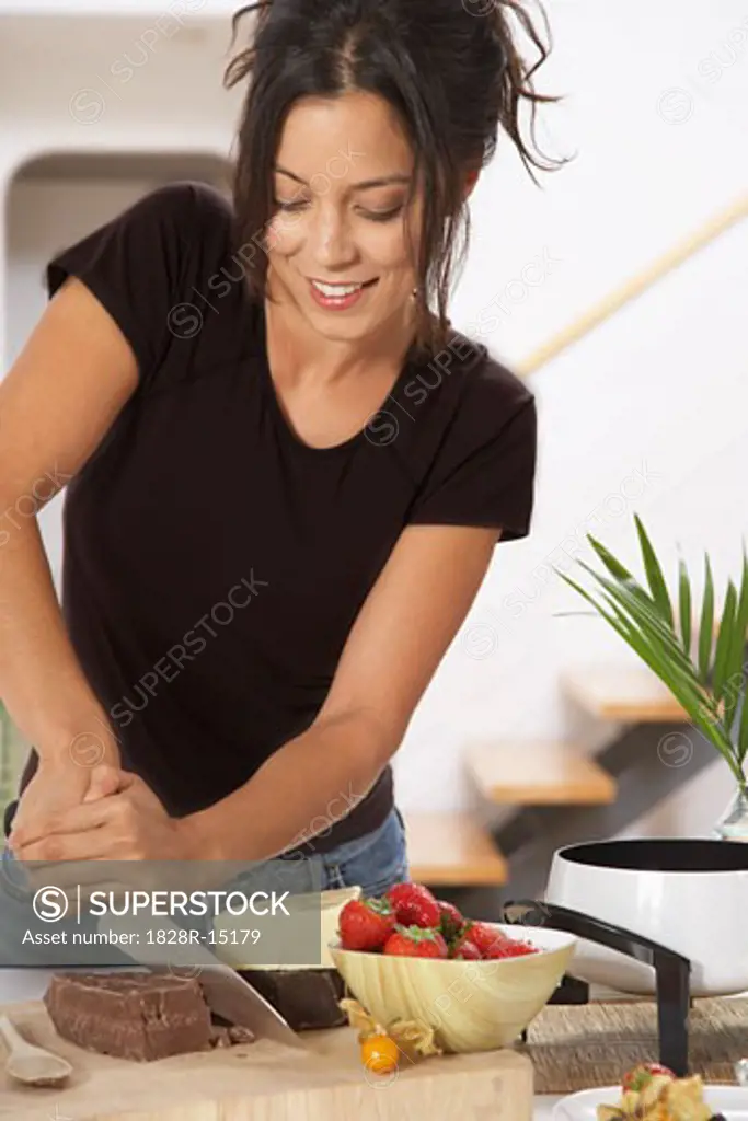 Woman Making Chocolate Fondue   