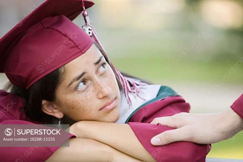 Graduate Being Comforted   