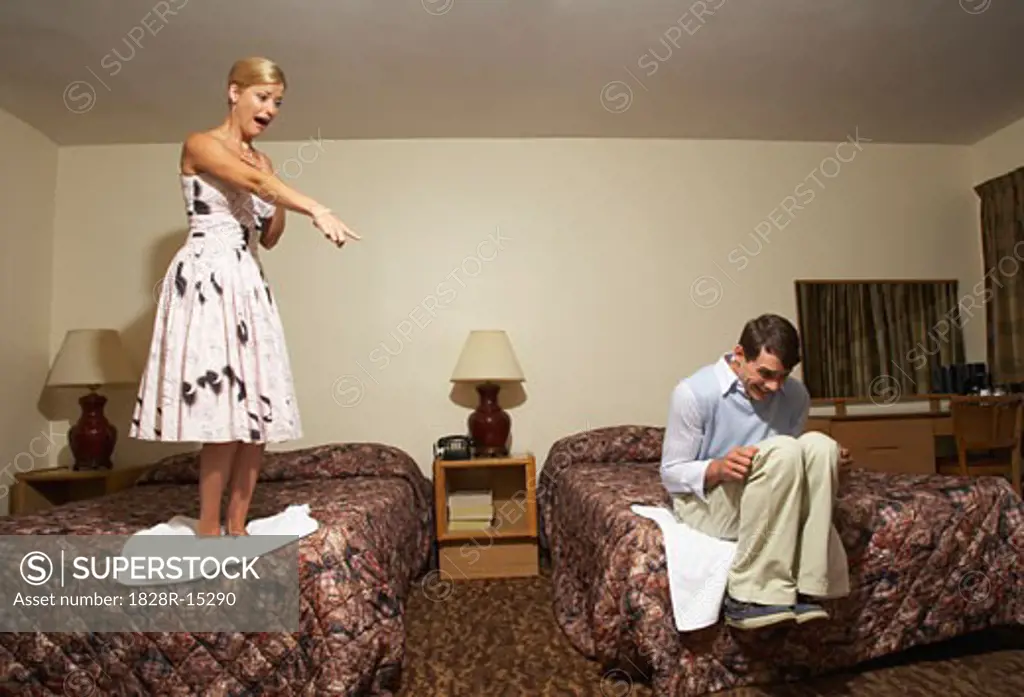 Frightened Couple in Motel Room   