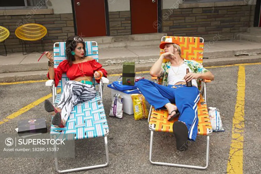 Portrait of Couple in Front of Motel, Lounging in Parking Lot   