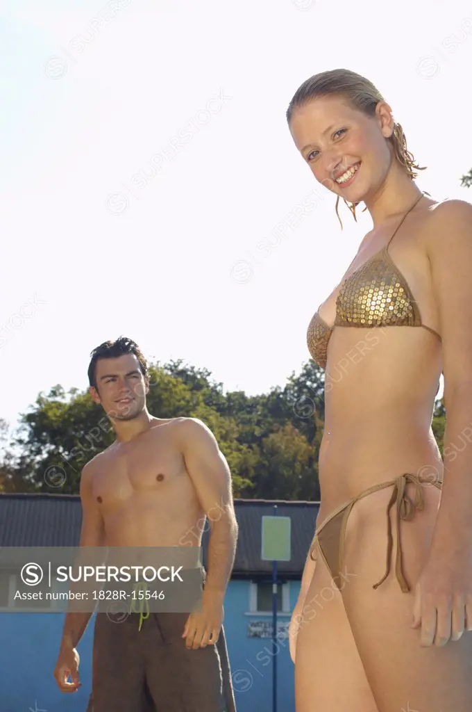 Man Looking at Woman in Bikini   