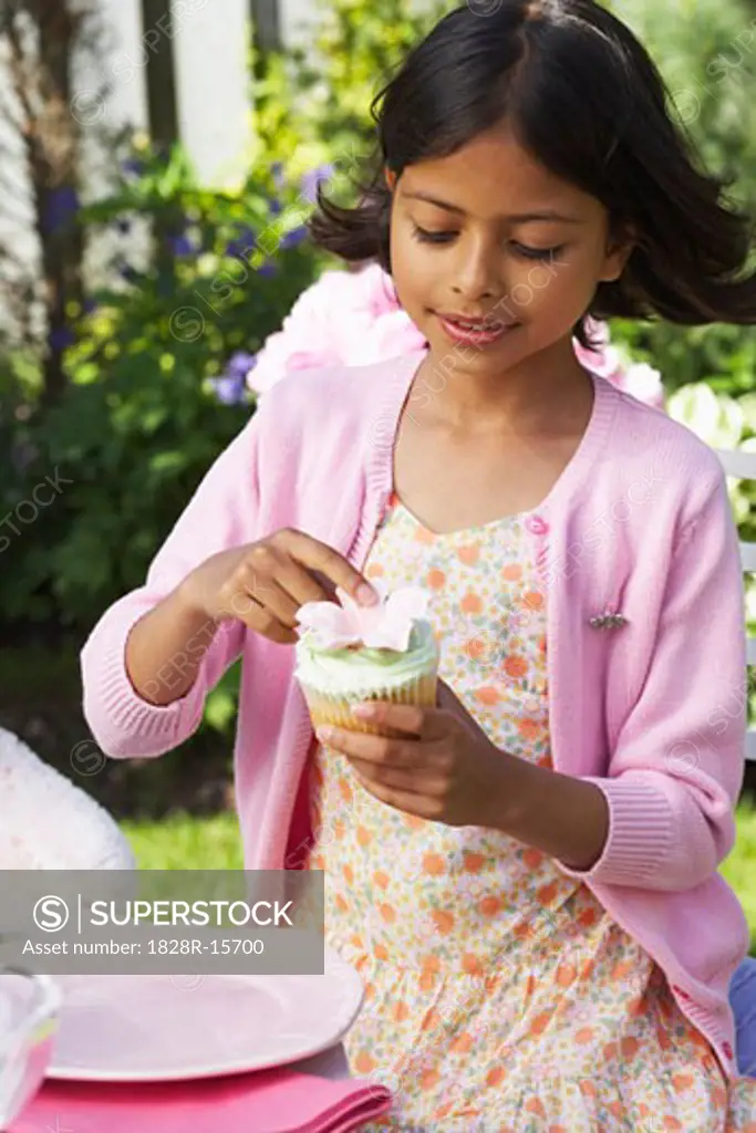 Girl Holding Cupcake   