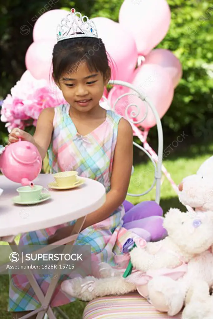 Girl Pouring Tea at Tea Party   