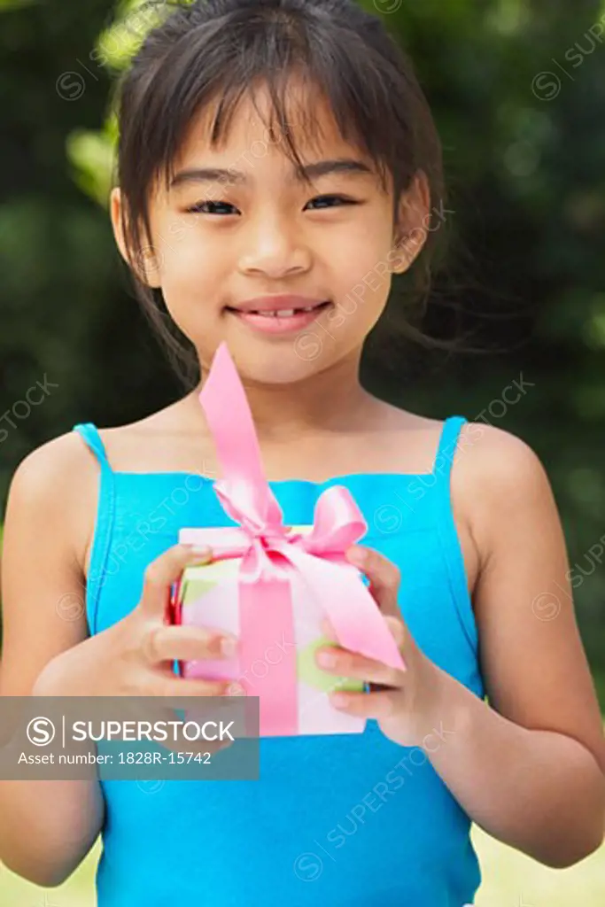 Portrait of Girl Holding Gift   