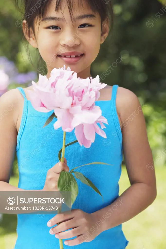 Portrait of Girl Holding Flower   