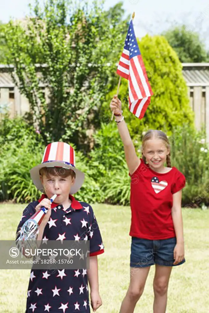 Portrait of Boy Wearing Stars and Stripes Top and Hat, Girl Holding American Flag   