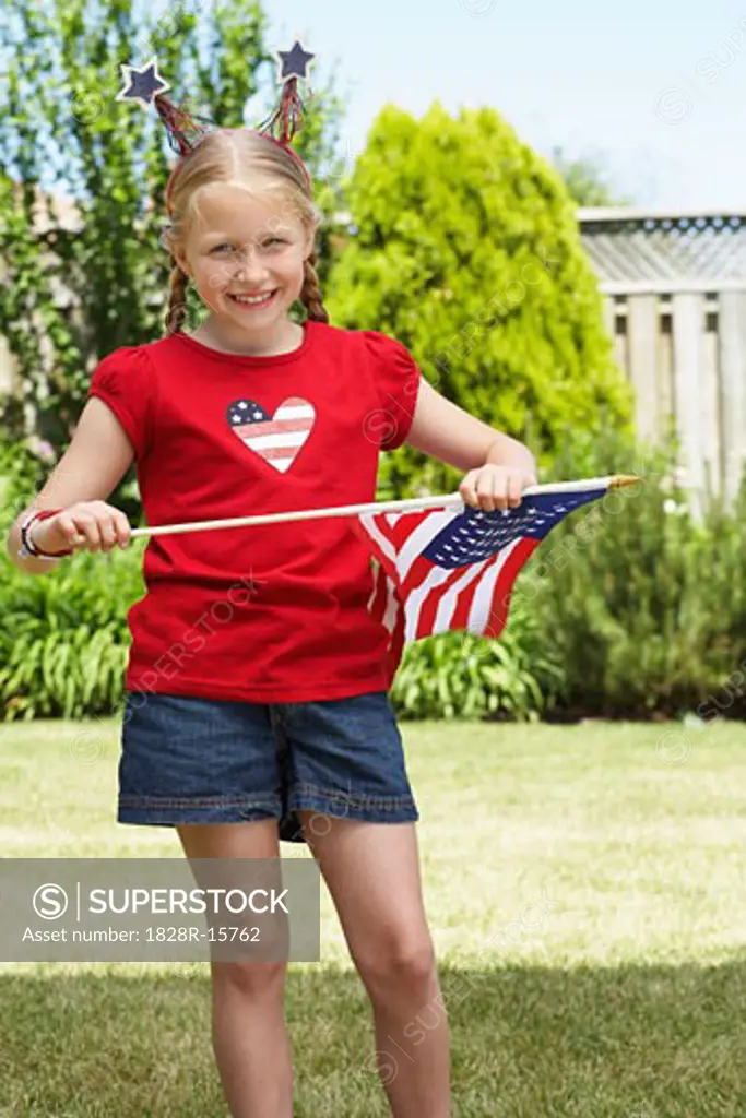 Portrait of Girl Holding American Flag   