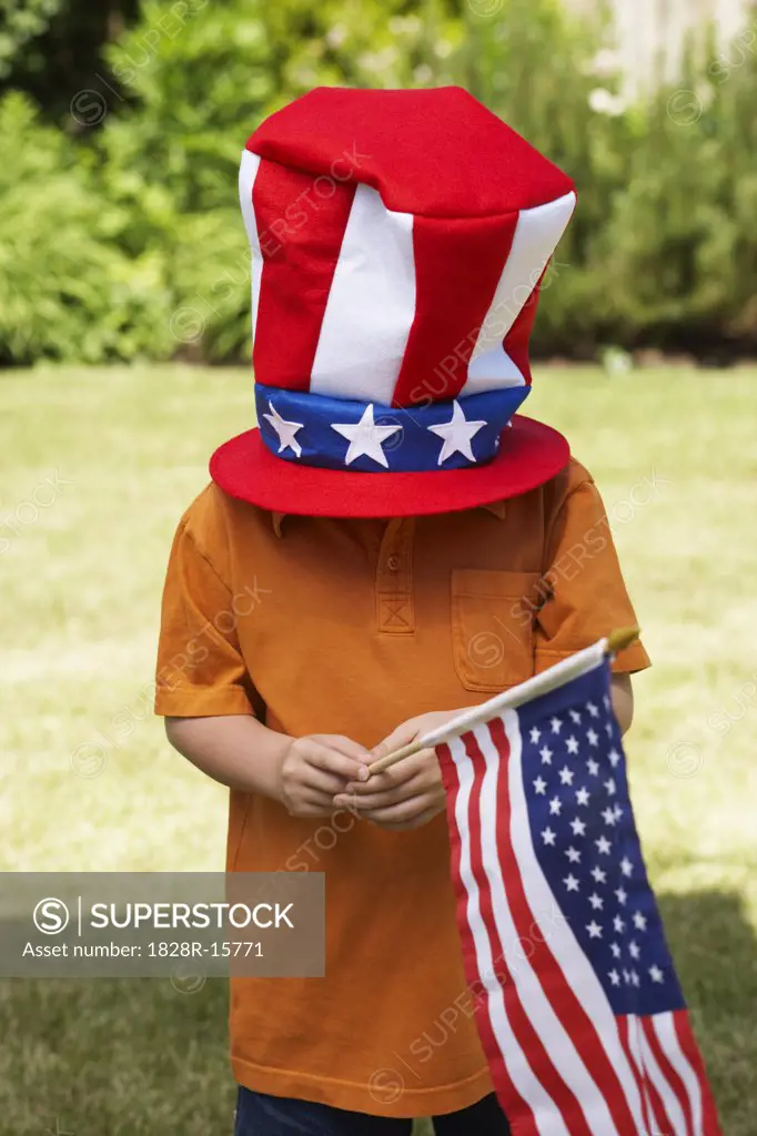 Portrait of Boy with Stars and Stripes Hat Covering Head   