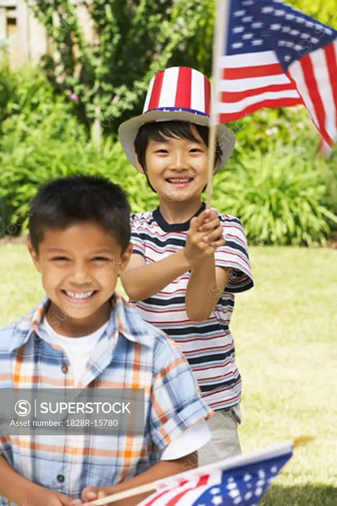 Portrait of Boys Holding American Flags   