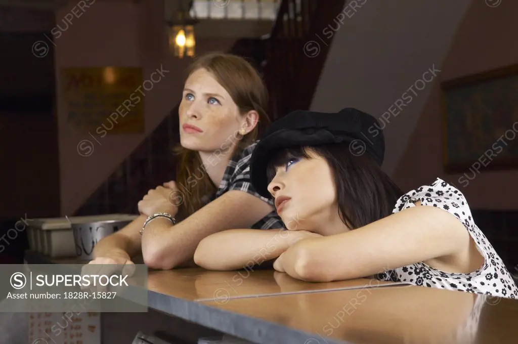 Women Leaning on Bar Counter   