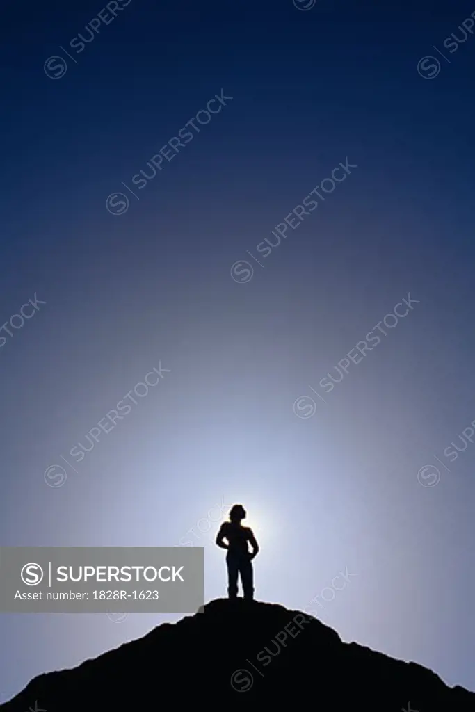 Silhouette of Man Standing on Mountain Top   