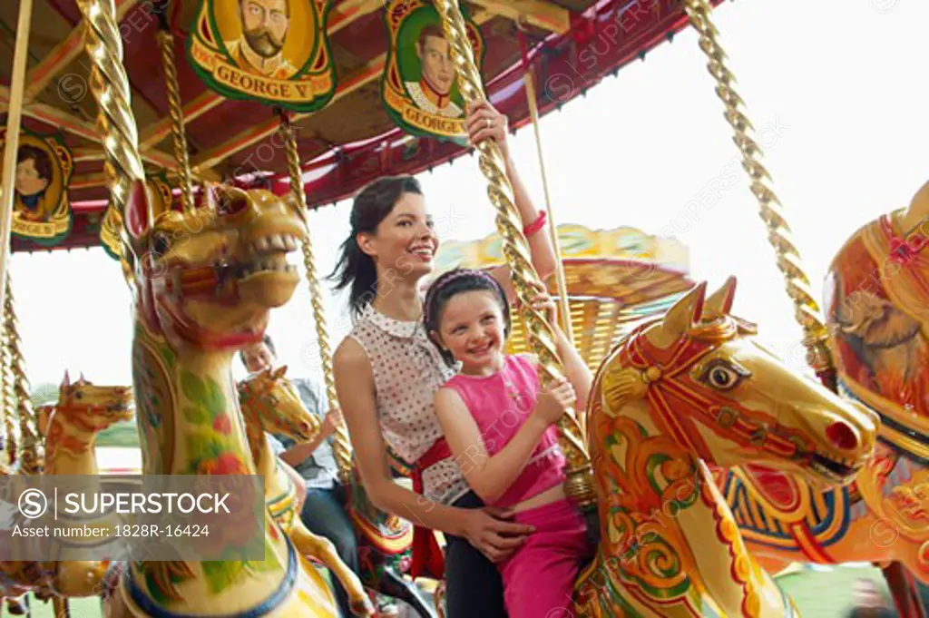Mother and Daughter on Merry-Go-Round, Carters Steam Fair, England   