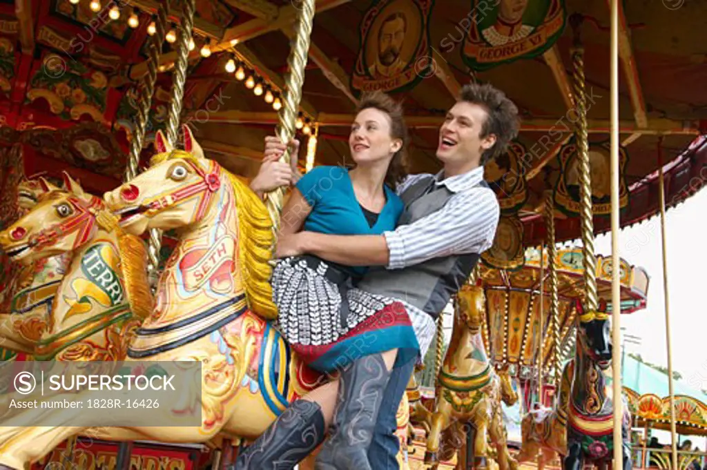 Couple on Merry-Go-Round, Carters Steam Fair, England   