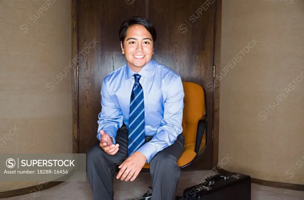 Businessman in Chair   