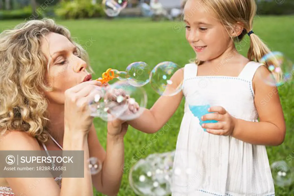 Mother and Daughter Blowing Bubbles   