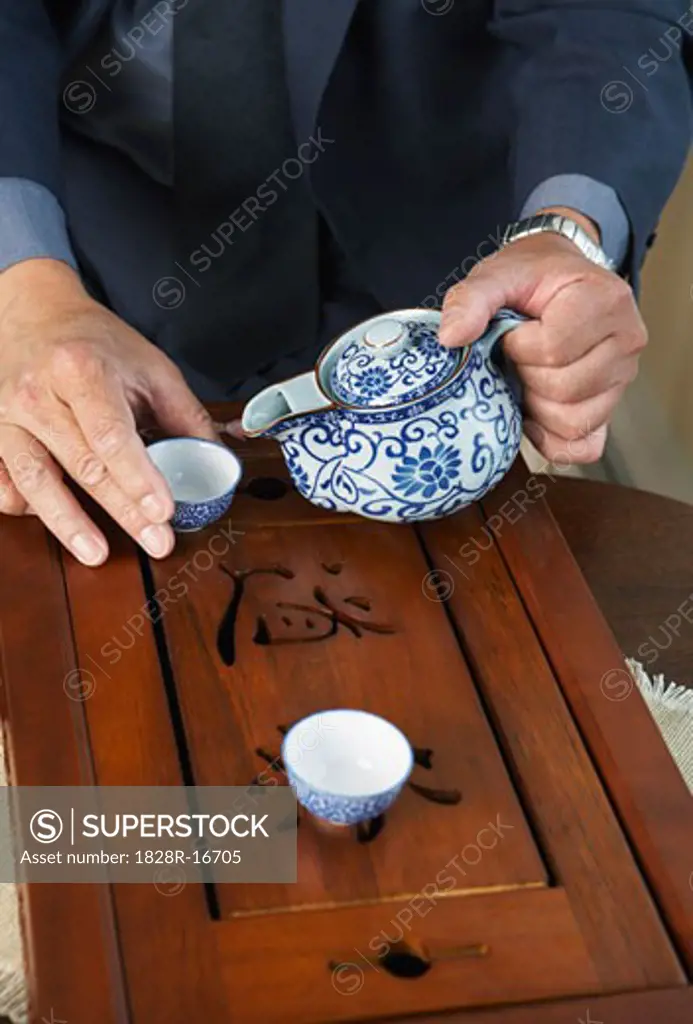 Man Pouring Tea   