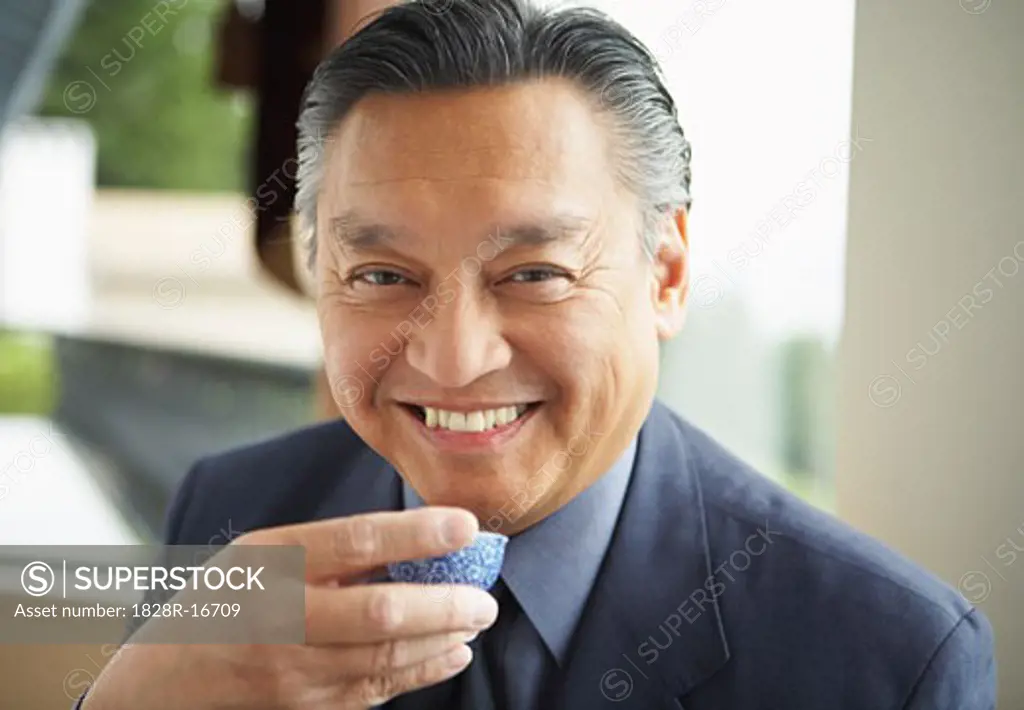 Portrait of Man Drinking Tea   