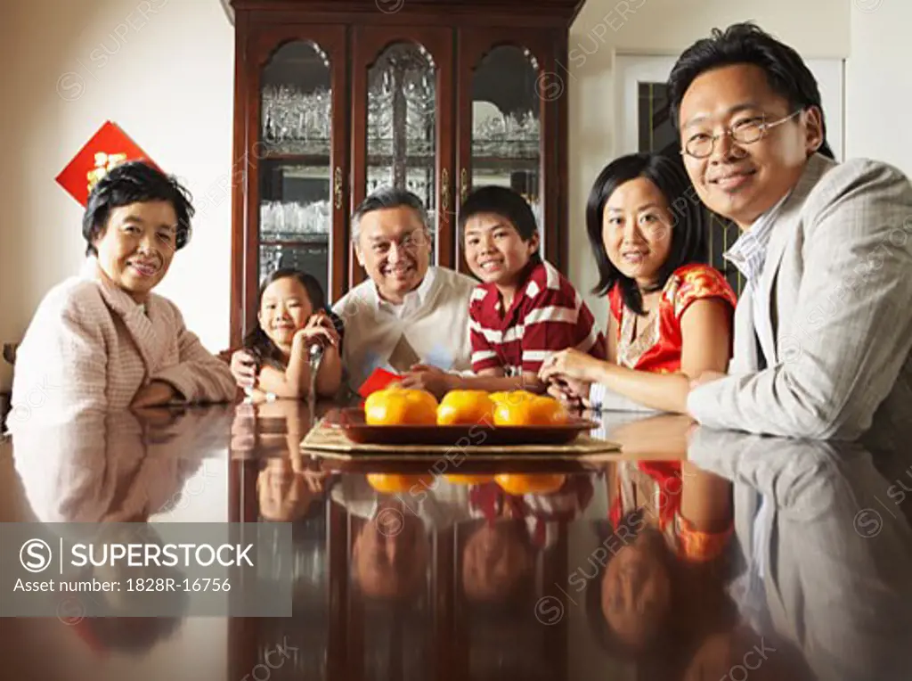 Portrait of Family around Dining Table   