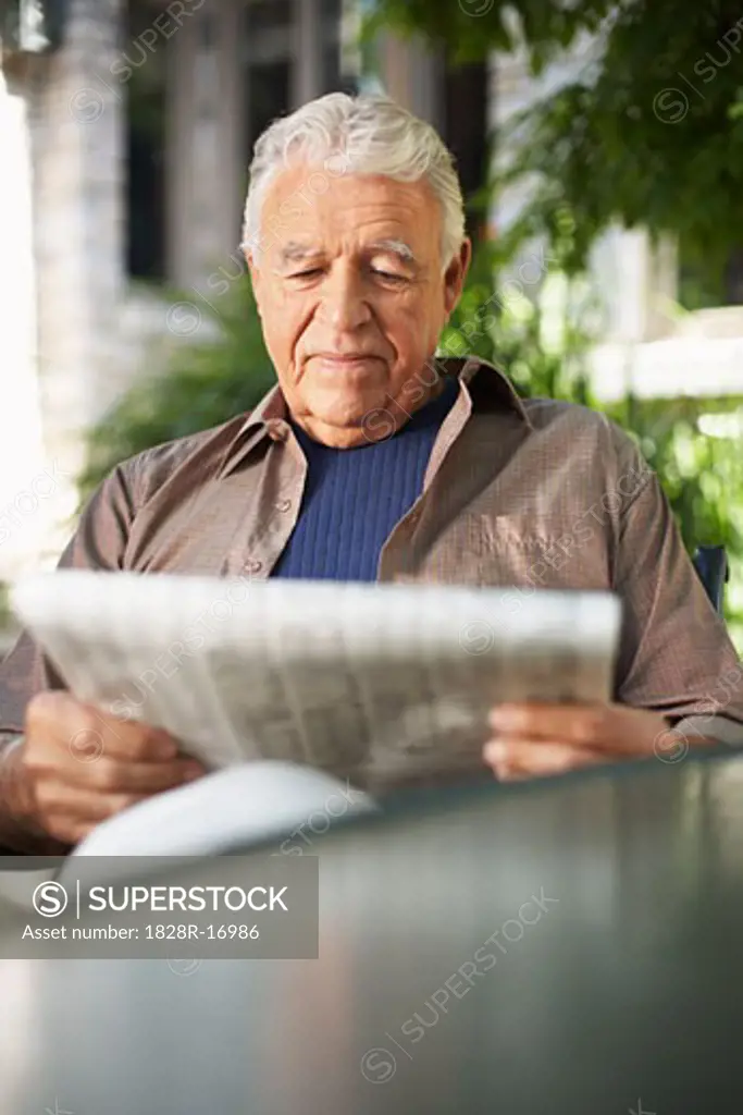 Portrait of Man Reading Newspaper   