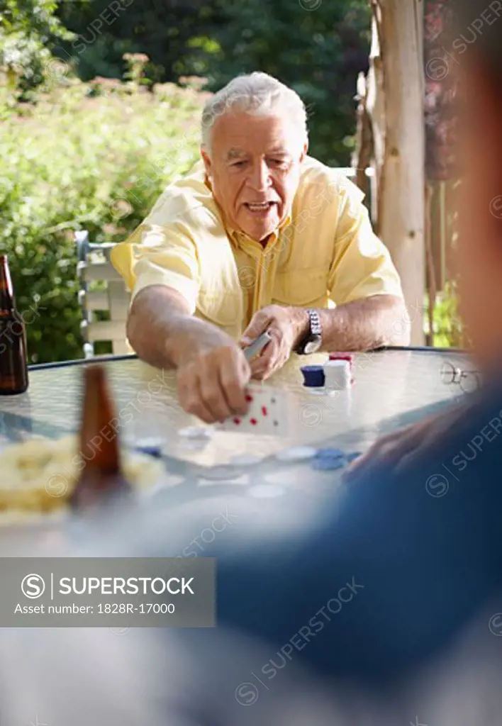 Man Playing Cards Outdoors   