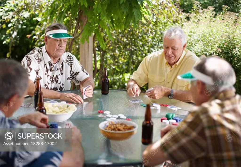 Men Playing Cards Outdoors   
