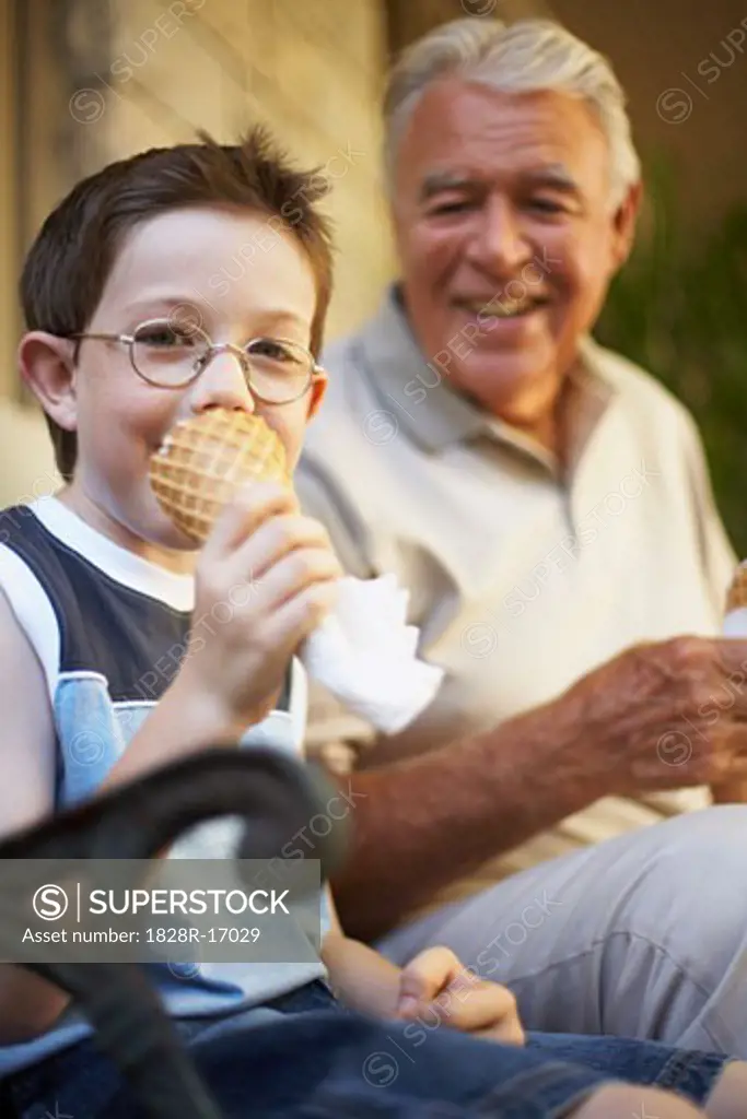 Grandfather and Grandson Eating Ice Cream Cones   
