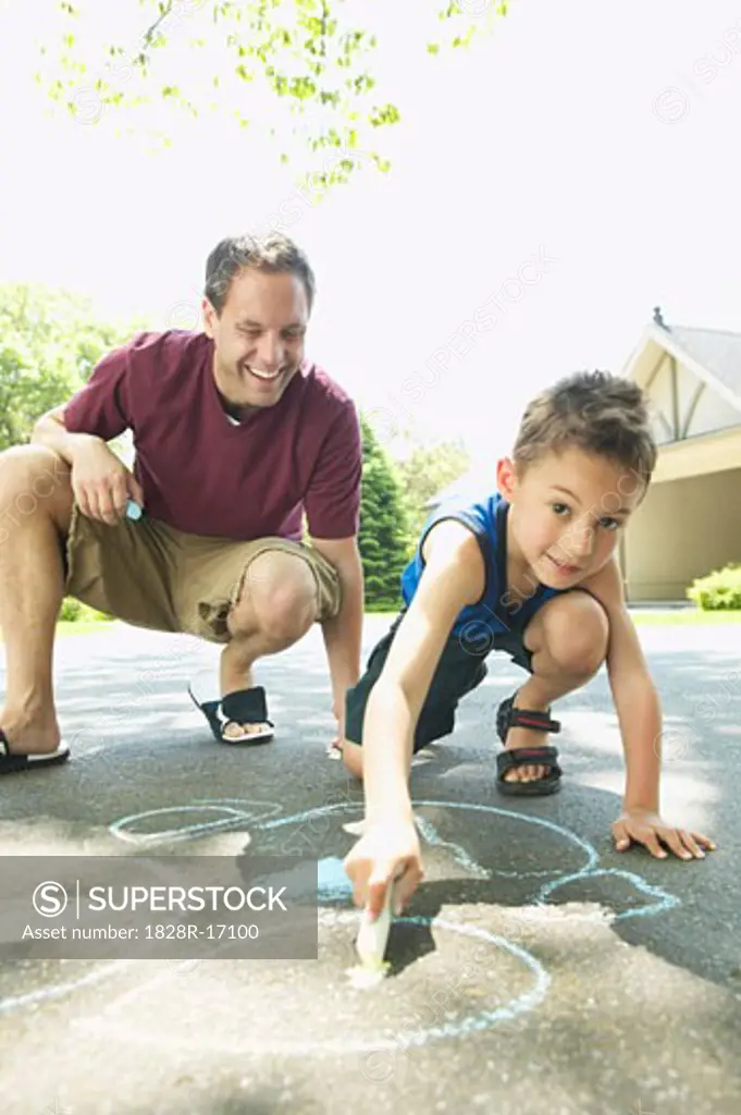 Father and Son Drawing with Chalk   