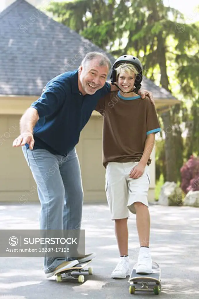 Grandfather and Grandson with Skateboard   