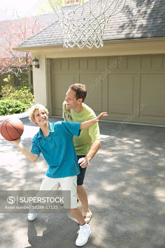 Father and Son Playing Basketball   