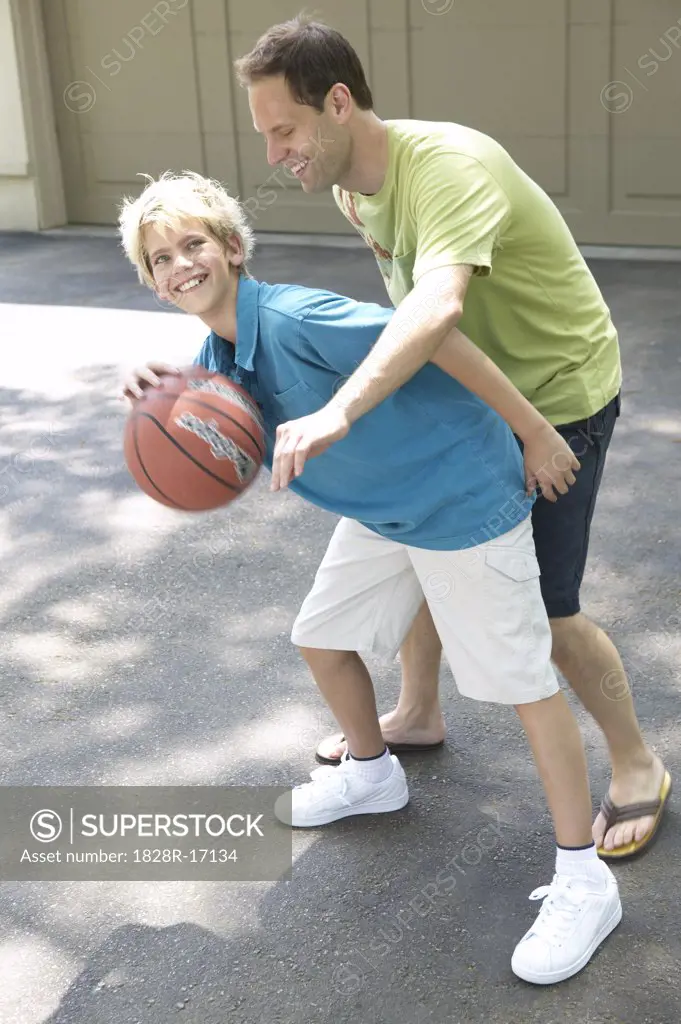 Father and Son Playing Basketball   