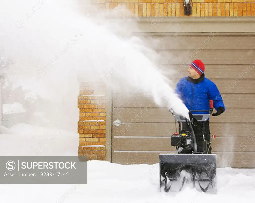 Man Using Snow Blower   