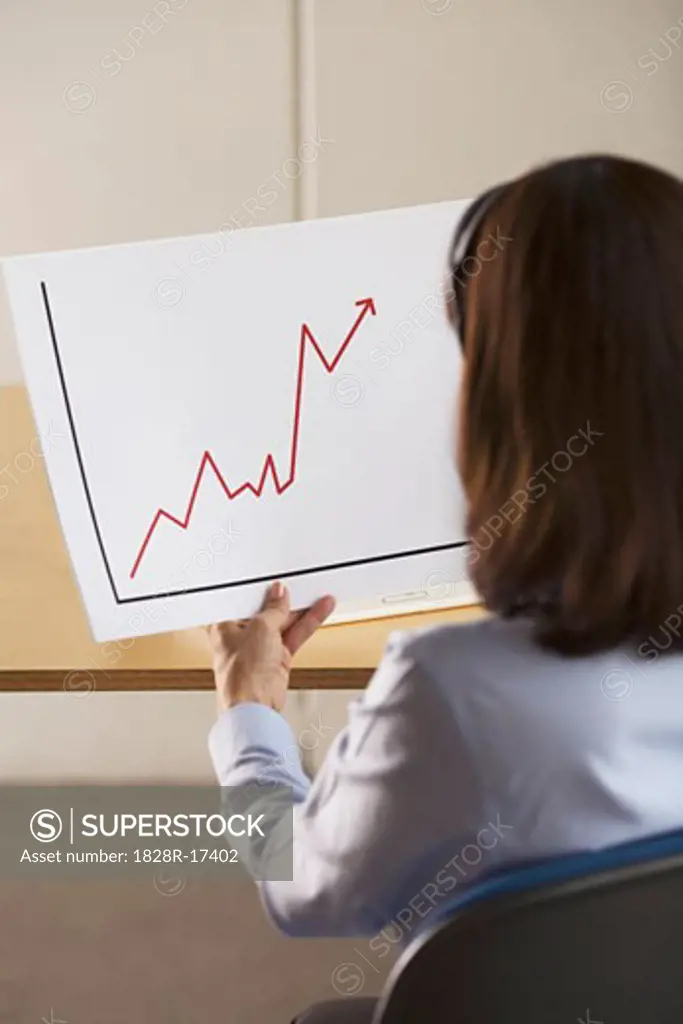 Woman Holding a Line Graph   