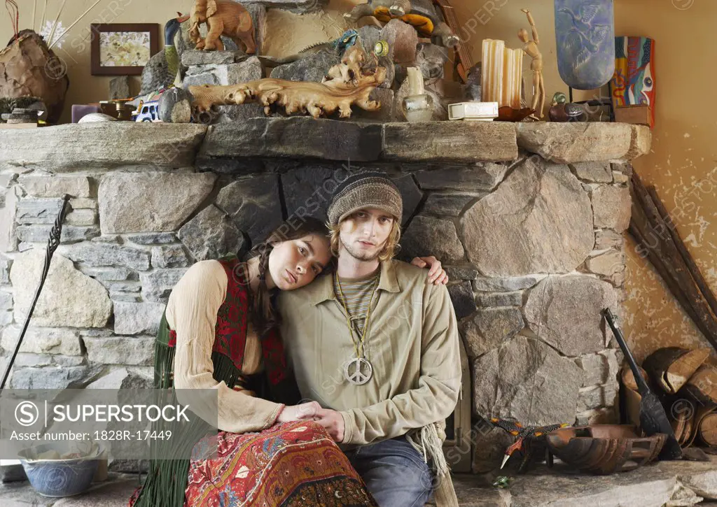 Hippie Couple in Front of Fireplace   
