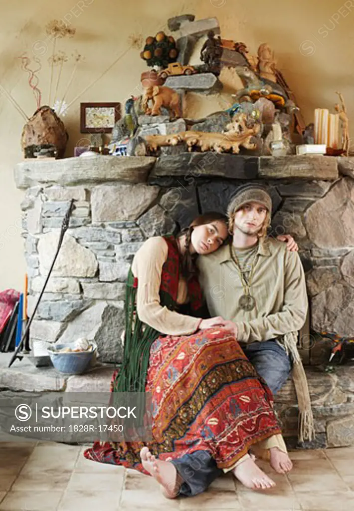 Hippie Couple in Front of Fireplace   