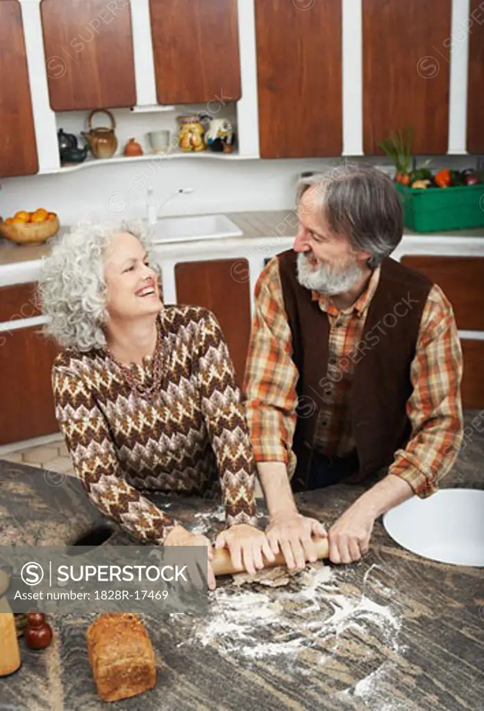 Couple Making Pastry in Kitchen   